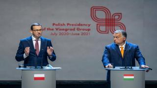 Poland's Prime Minister Mateusz Morawiecki speaks as Hungary's Prime Minister Viktor Orban looks on during a joint press conference after a Visegrad Group (V4) meeting in Lublin, September 11, 2020. (Photo by Wojtek RADWANSKI / AFP) (Photo by WOJTEK RADWANSKI/AFP via Getty Images)