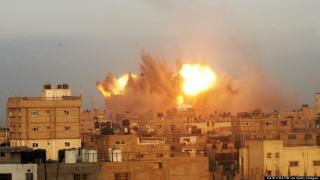 A ball of fire is seen following an early morning Israeli air strike, on July 11, 2014, on Rafah in the southern of Gaza strip. Israeli warplanes kept up deadly raids on Gaza but failed to stop Palestinian militants firing rockets across the border, as the United States offered to help negotiate a truce. AFP PHOTO / SAID KHATIB (Photo credit should read SAID KHATIB/AFP/Getty Images)